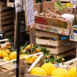 a bunch of crates filled with lots of fruit